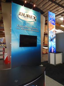 RENTAL: (2) 15 ft. High Double-Sided Lightbox Kiosks with RE-1202 Rectangular Counters, (2) RE-1205 Large Curved Counters, 60 in. Monitor, and SEG Fabric Graphics, and Direct Print Sintra Counter Graphics