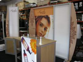 eSmart Modified ECO-1048 with EcoBoard Wings, Modified ECO-35C Counter with Backlit Graphics, Acrylic Shelving, and SEG Fabric Graphics and a Custom Kiosk with Storage -- Image 1