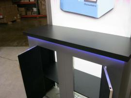 Modified eSmart ECO-4008 Sustainable Island Exhibit with Hanging Aero Sign, Counter Top LED Lighting, Large Backlit Graphics, and (3) Storage Counters. Converts to 10 ft. and 20 ft. Inlines -- Image 5