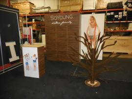 Custom Modular Exhibit with Slatwall, Storage, Reception Counter, Backlit Graphics, and Metal Product Display (tree) -- Image 4