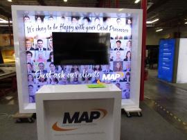 VK-1340 Custom Exhibit with LED Lightbox, Monitor Mount, Fabric Graphic, and MOD-1563 Reception Counter