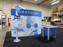 Modified Gravitee GK-1011 Modular Exhibit with Tension Fabric Graphics, Monitor Kiosk, and Custom Product/Workstation with Storage