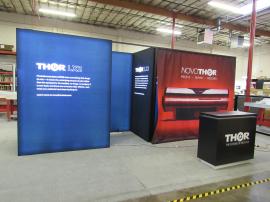 Custom Inline Exhibit with Double-sided SuperNova LED Lighboxes and Custom Reception Counter with Locking Storage -- Front