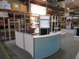 ECO-2018 and ECO-1065 Sustainable Exhibits with ECO-5C Counter, Monitor Mount, Locking Storage, and Meeting Area