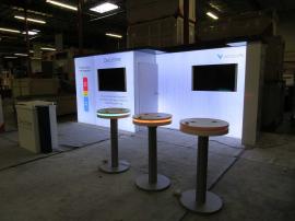 Modified VK-2984 Backlit Exhibit with SEG Graphics, Monitor Mount, Locking Closet, (3) MOD-1462 Charging Tables, and MOD-1591 Reception Counter