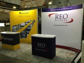 RENTAL: (2) 10 x 10 Curved Gravitee System Inline Exhibits with LED Arm Lights and SEG Fabric Graphics, and (2) RE-1558 Gravitee Reception Counters with SEG Fabric Graphics